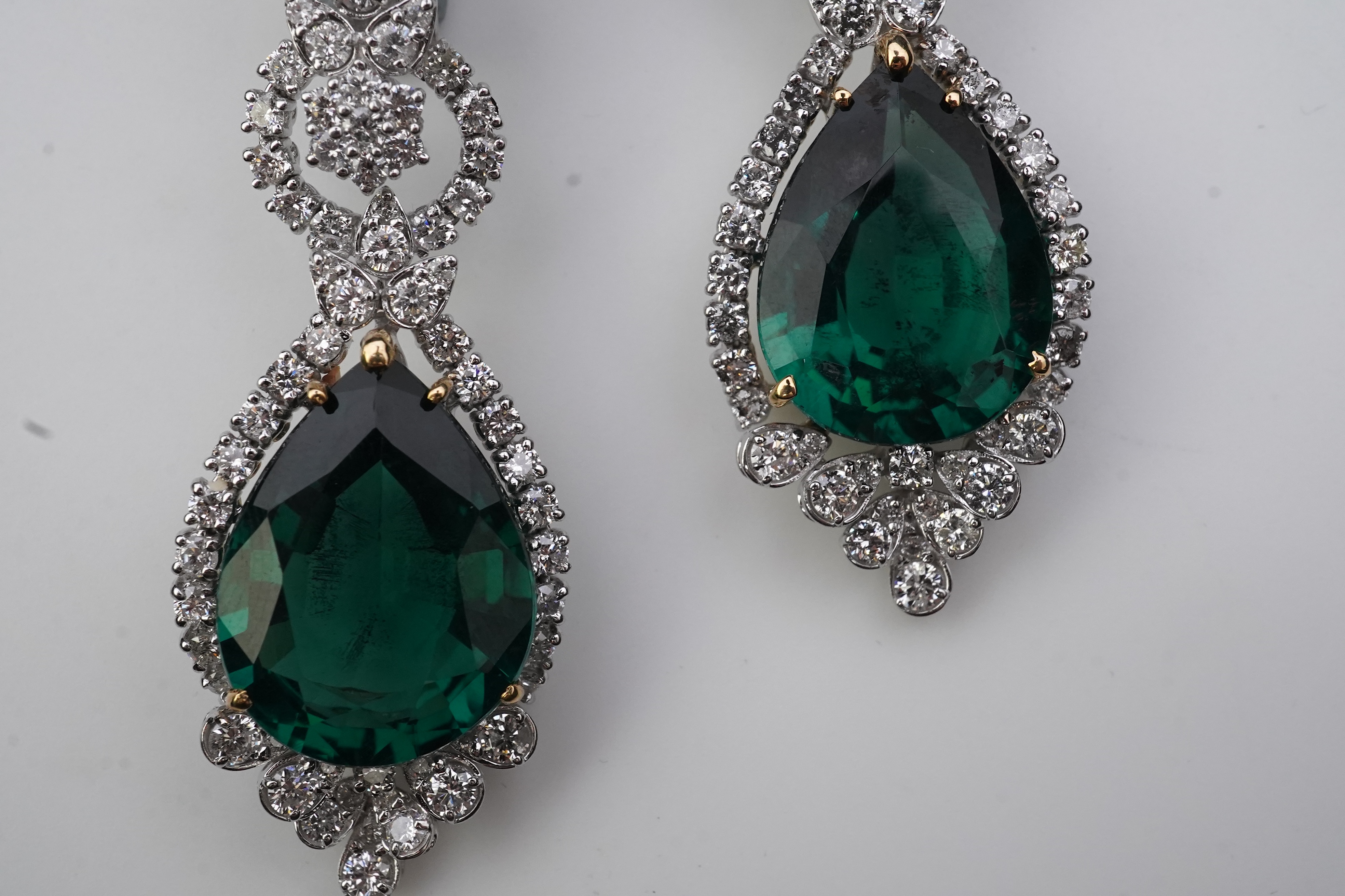 A pair of synthetic green quartz and diamond earrings